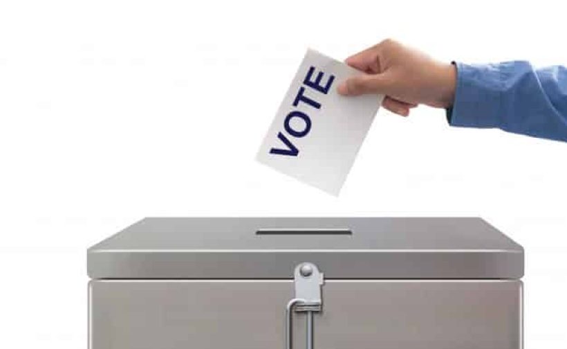 hand-putting-voting-paper-elections-and-concept-democratie_51195-3364